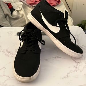 Black and white Nikes Sb mid